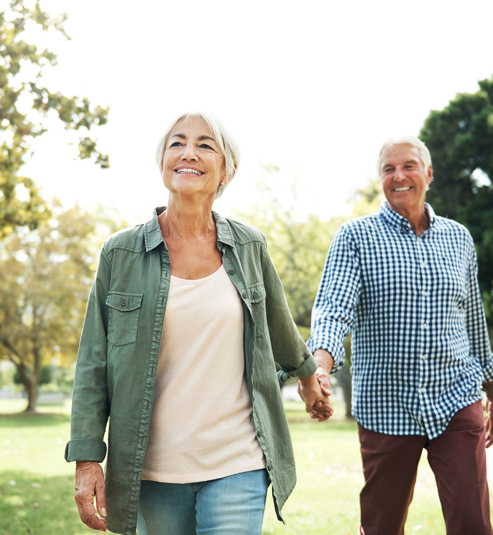 Woman at the beach wearing hearing aids and having fun with her friends.